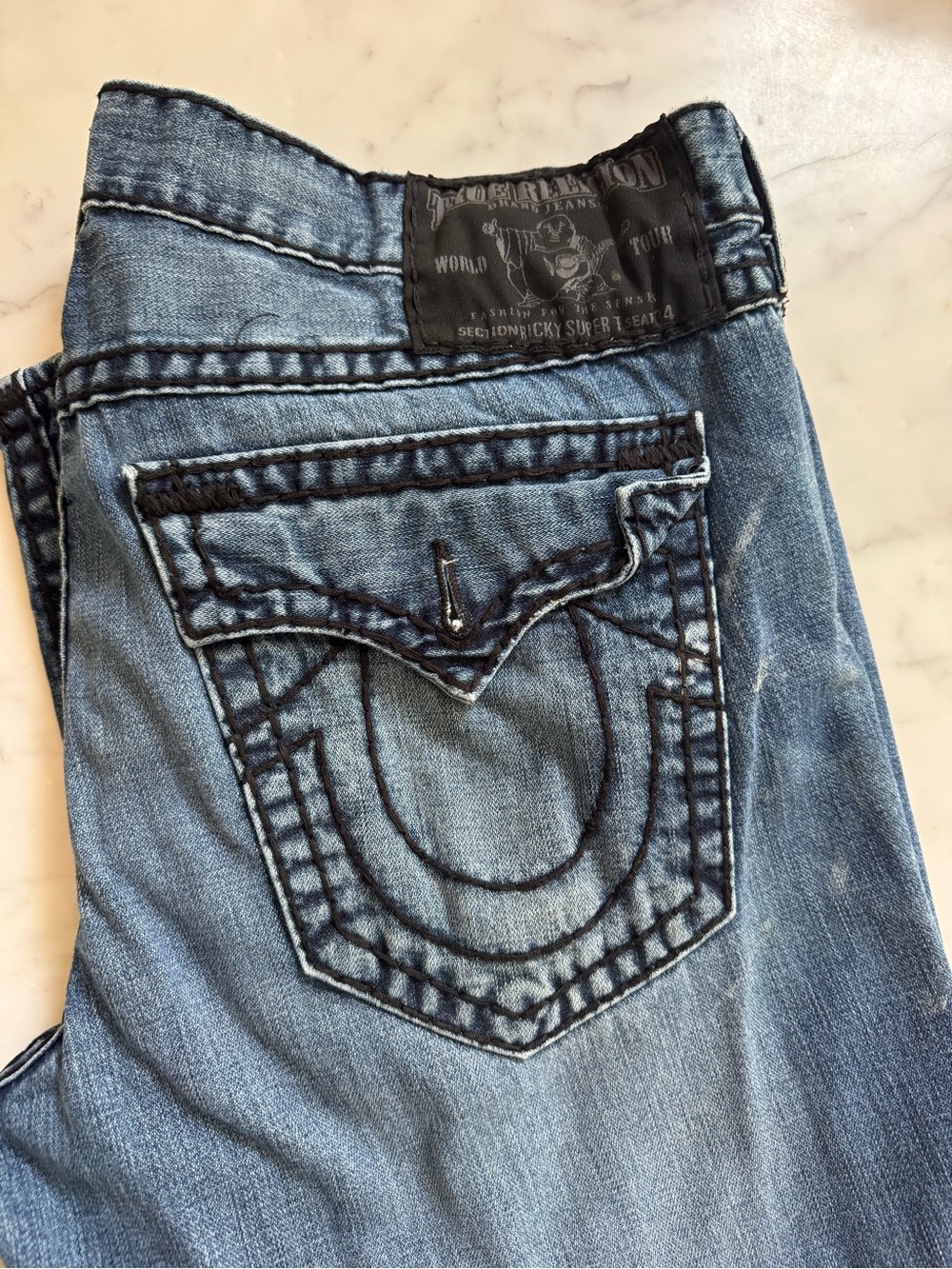 True Religion Men’s Relaxed Jeans in Light Blue Wash